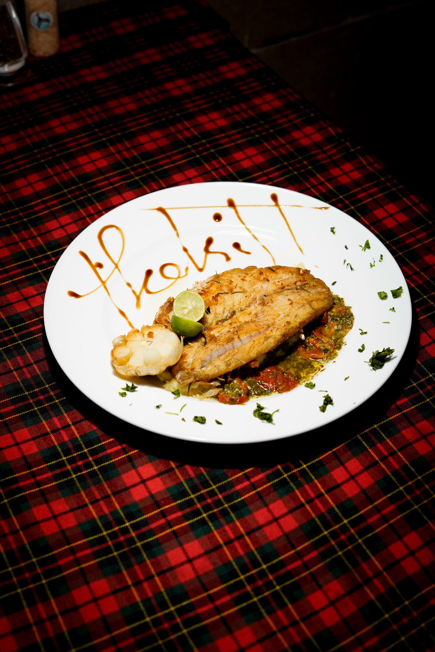 Grilled fish with roasted garlic