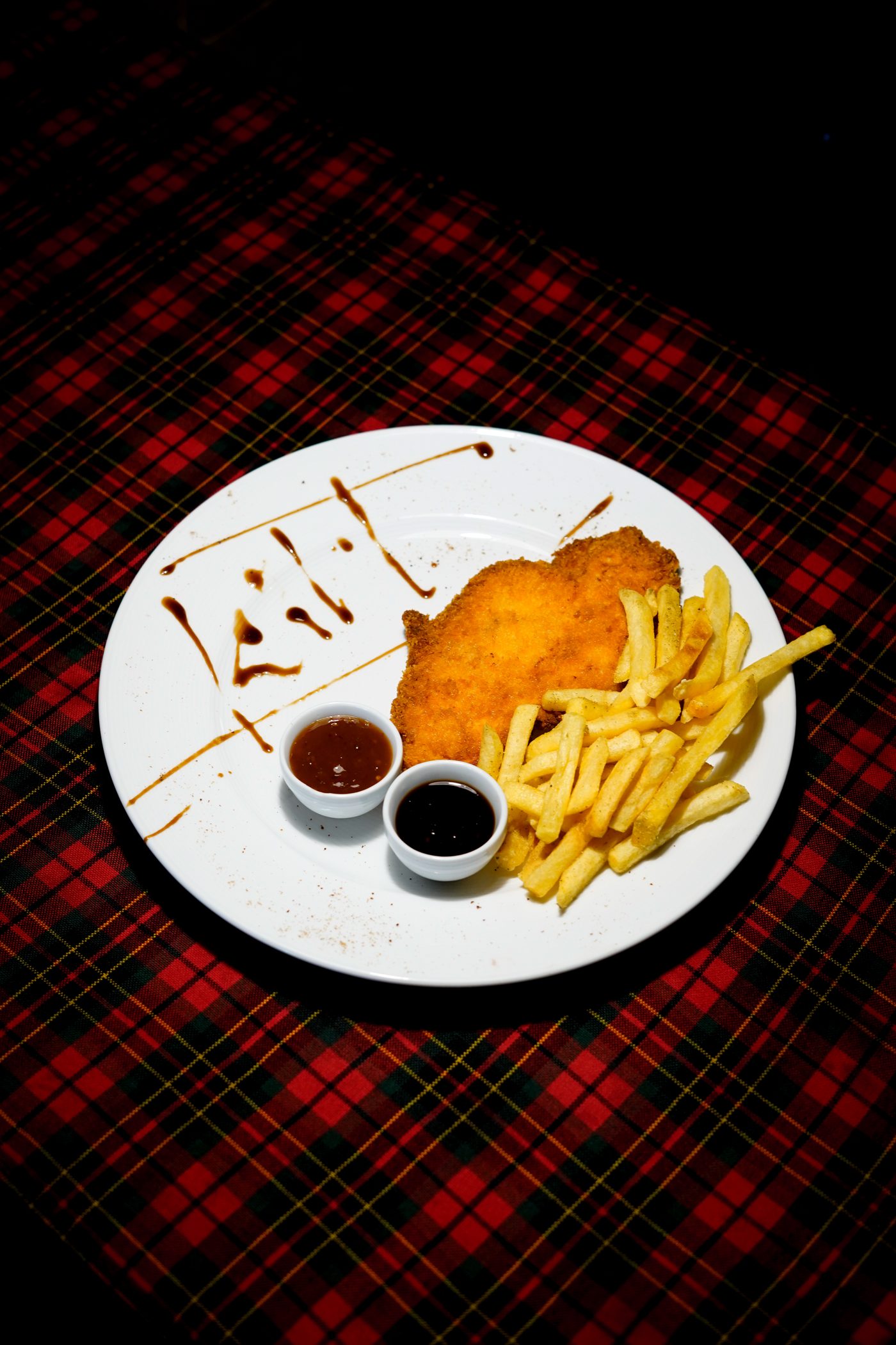 Schnitzel with fries and dipping sauces