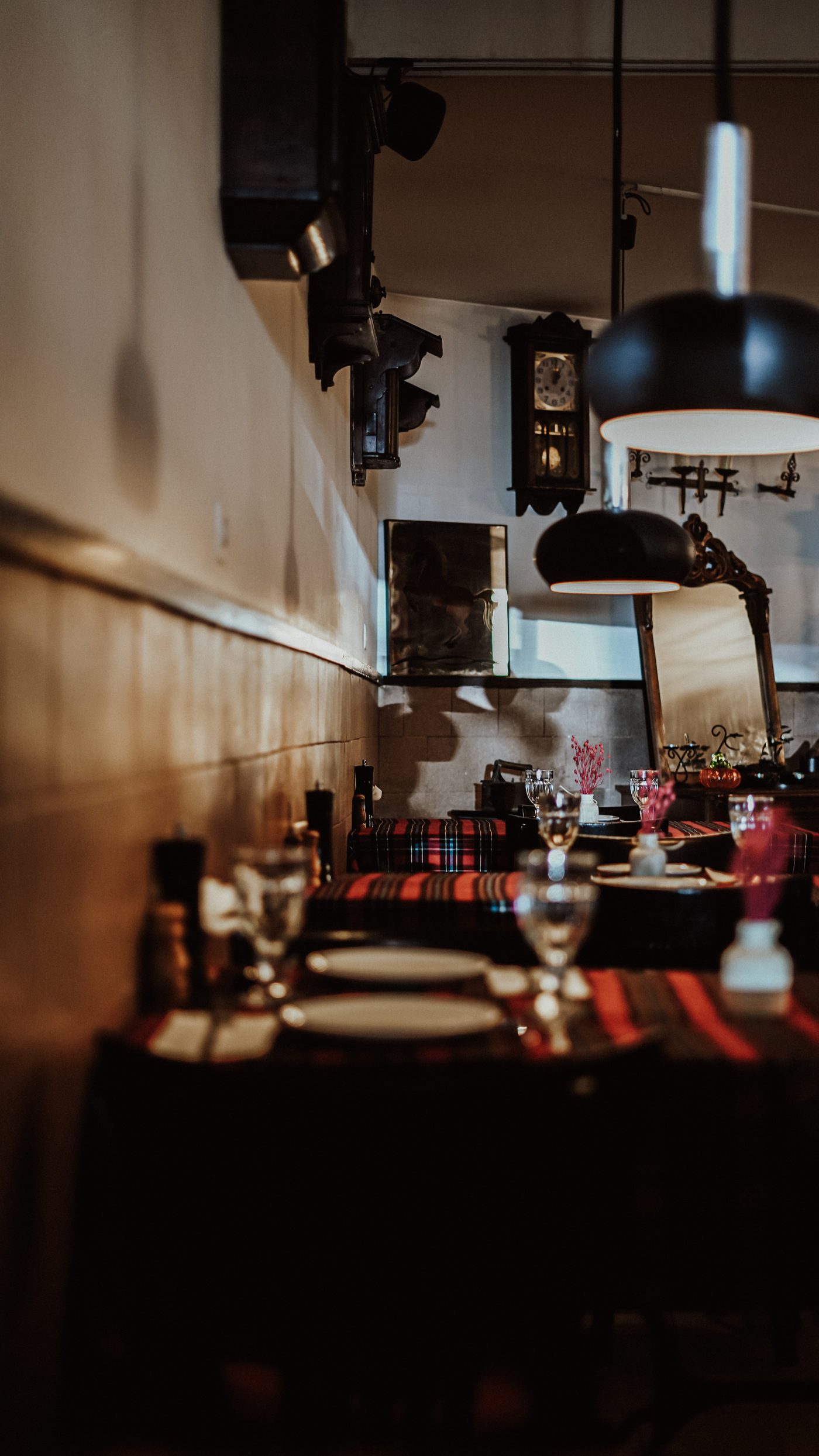 Candlelit dining hall with tartan tablecloths