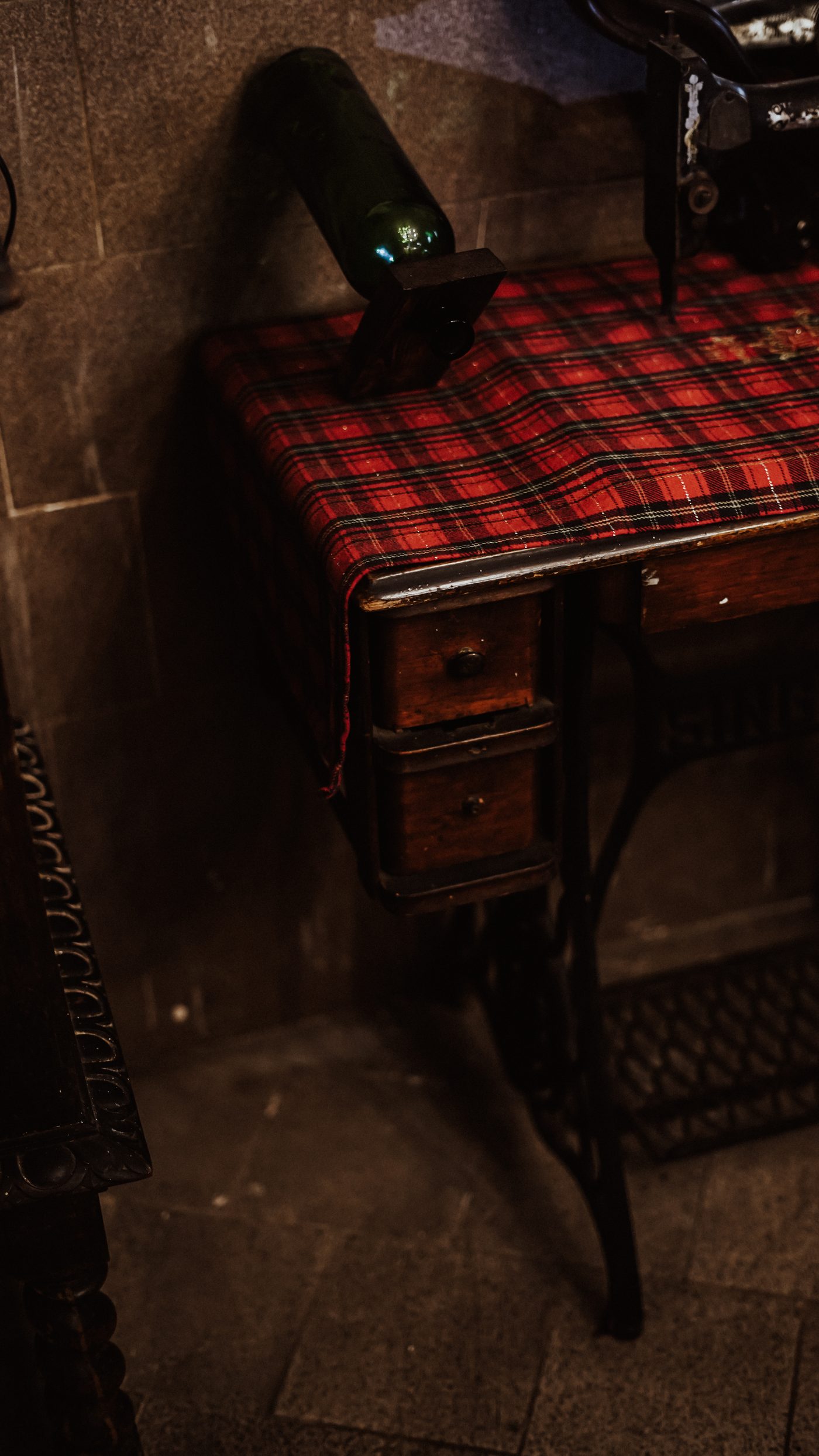 Vintage sewing machine with tartan runner