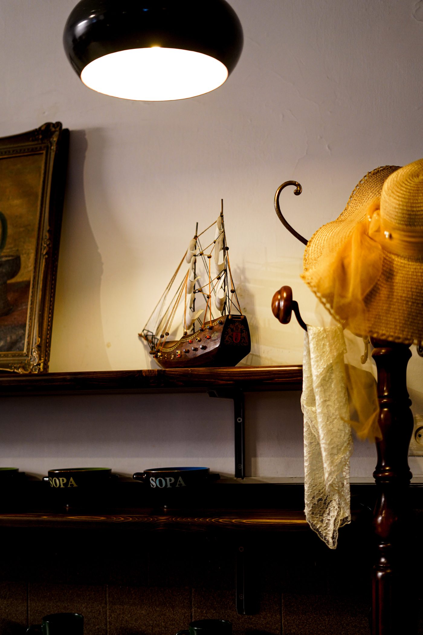Model ship and vintage shelf decor