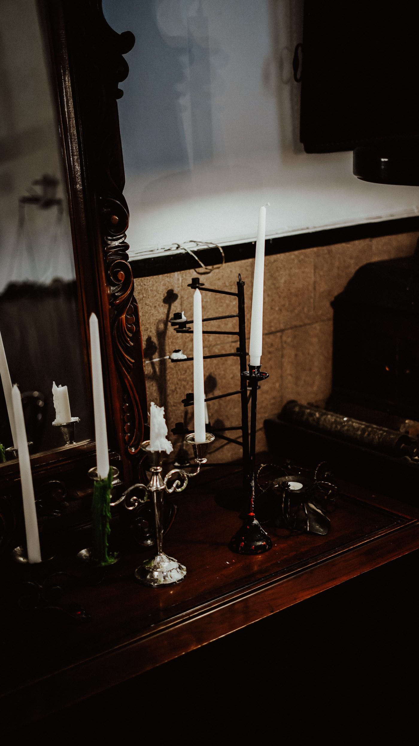 Candles reflected in carved mirror