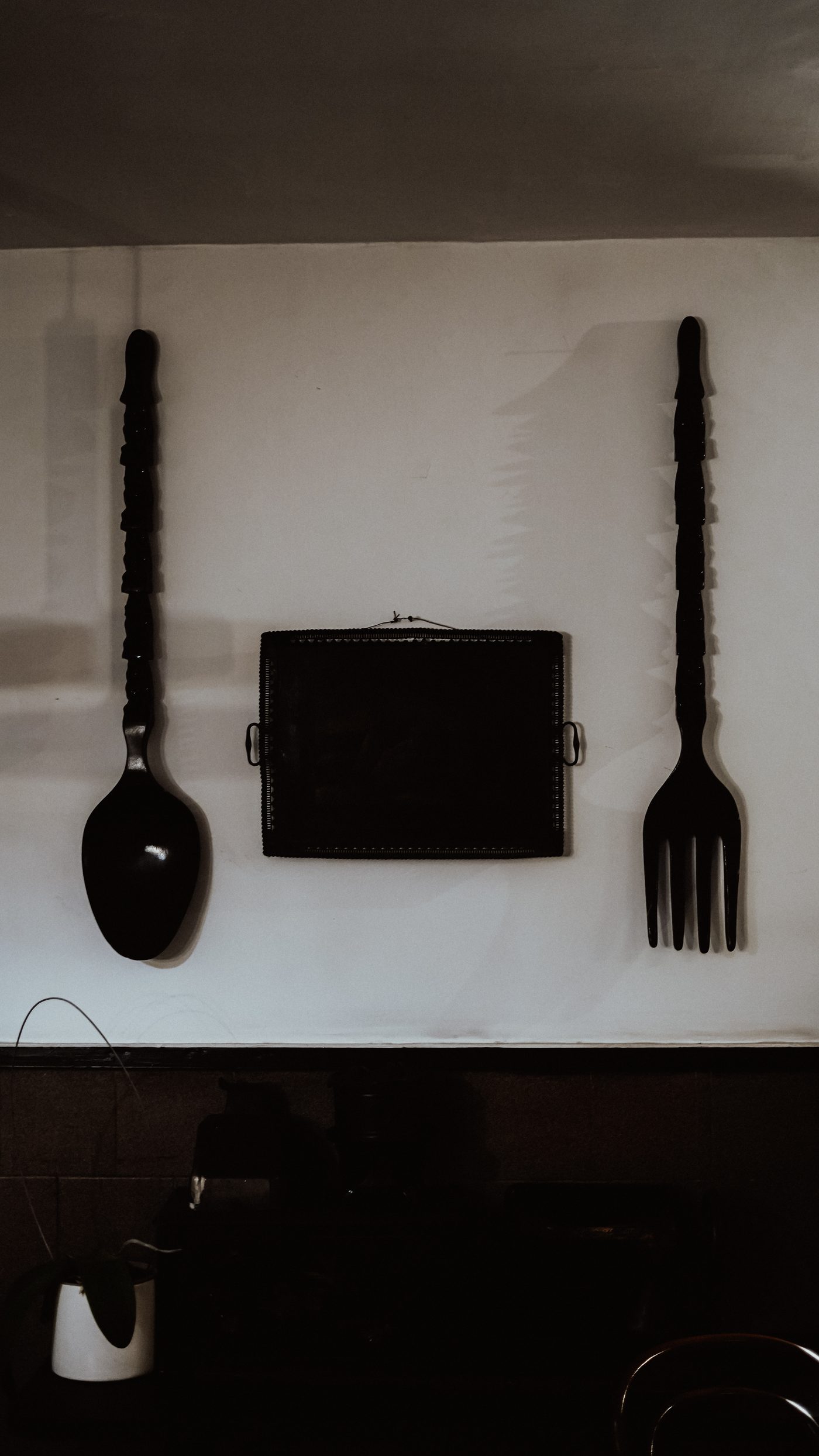 Oversized wooden spoon and fork wall decor